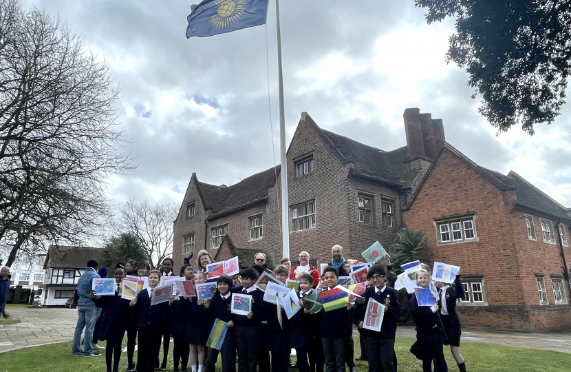 Photo of Sir James Duddridge KCMG MP, Anna Firth MP, the Mayor of Southend and pupils from St Helen’s Catholic Primary School with their hand drawn flags following the raising of the Commonwealth Flag for Peace.