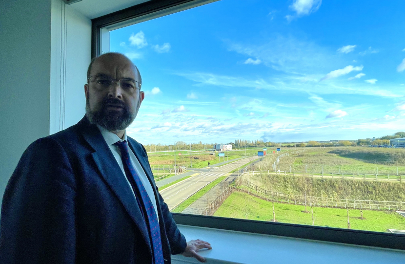 Photo of Sir James Duddridge KCMG MP overlooking sites for development at the Airport Business Park.