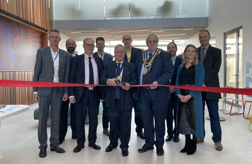 Photo of Sir James Duddridge KCMG MP alongside representatives from Southend City Council, Rochford District Council, South East Essex Local Enterprise Partnership and Oxford Innovation Space, cutting the ribbon. 