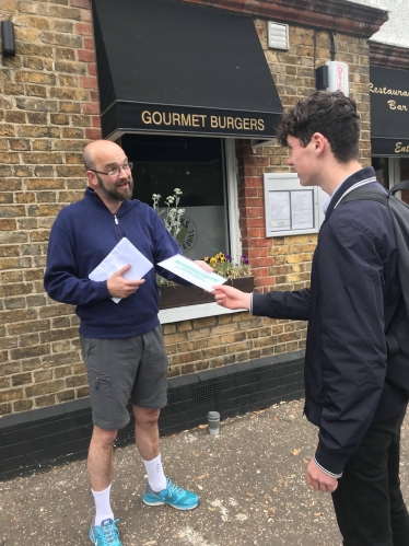 James Duddridge handing out commuter surveys