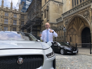 James Duddridge with the electric car outside Parliament 