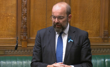 Sir James with his blue ribbon in the House of Commons